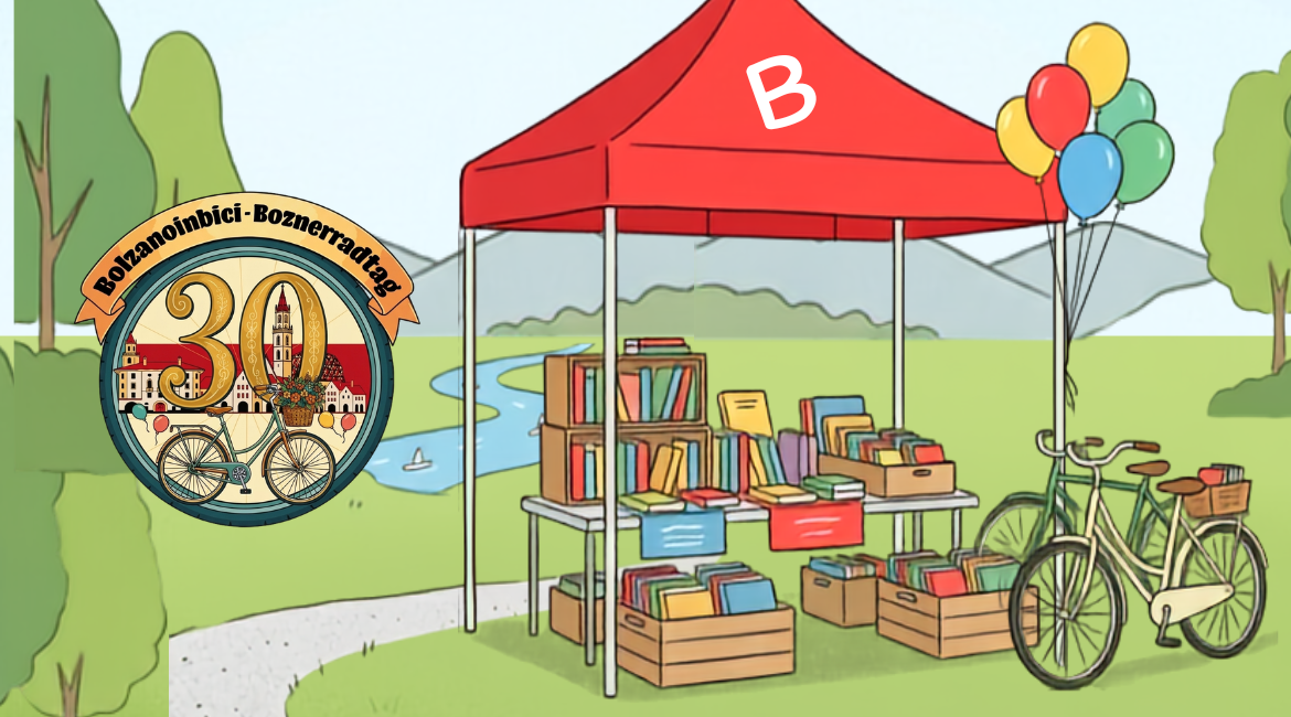 Nell'immagine si vede un parco con uno stand rosso di libri, alcune bici e il logo della manifestazione Bolzanoinbici.
