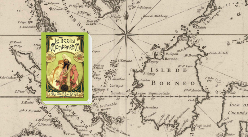 La copertina vintage del libro "Le tigri di Mompracem" di Emilio Salgari si trova sullo sfondo di una mappa ottocentesca del Borneo.